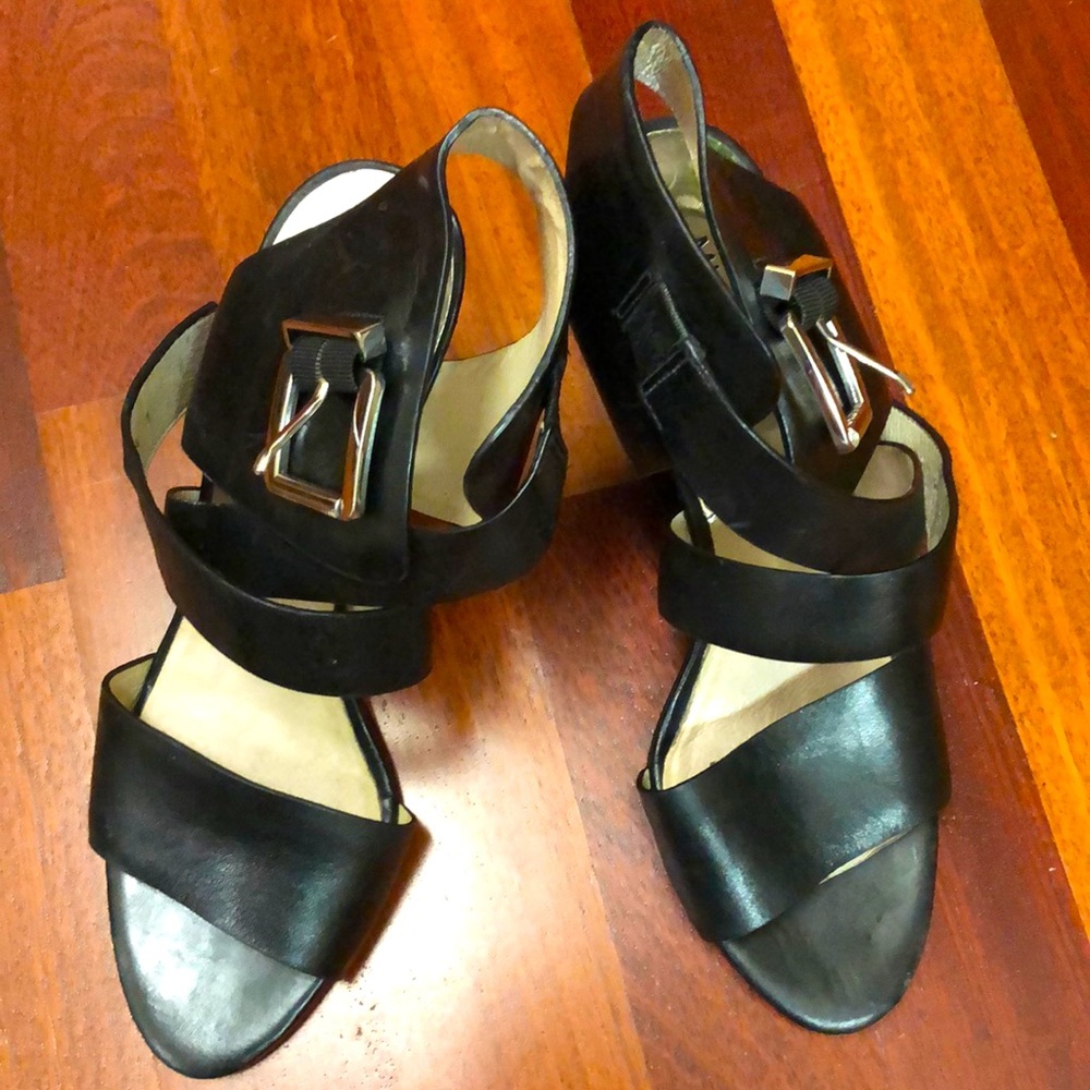 Michael Kors 3 1/2” heel. Run a little small 9